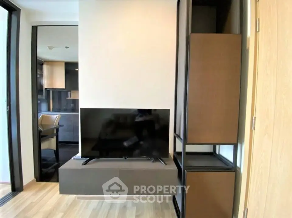 Modern living room with sleek TV setup and stylish furniture