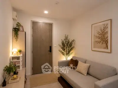Cozy living room with modern decor and plush sofa, perfect for relaxation.