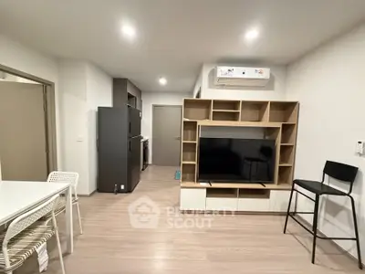 Modern living room with sleek furniture and open kitchen layout, perfect for contemporary living.