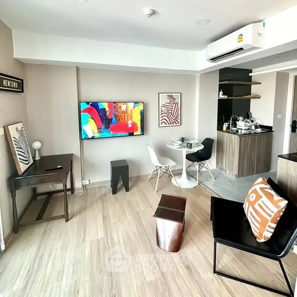 Modern living room with stylish decor and open kitchen layout