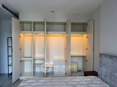 Spacious bedroom with built-in wardrobe and cozy lighting