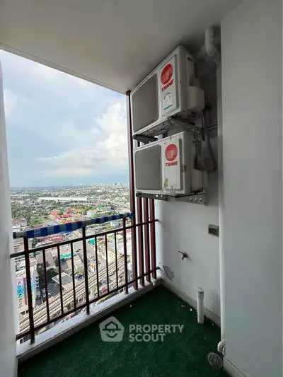 High-rise balcony with air conditioning units and stunning city view