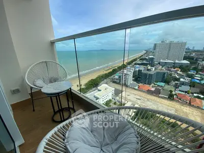 Stunning high-rise balcony with breathtaking ocean view and modern seating.