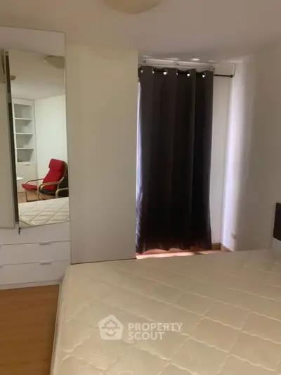 Modern bedroom with sleek design and cozy ambiance