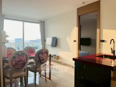 Modern living room with stylish dining area and large windows offering city views.