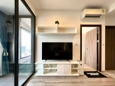 Modern living room with sleek TV stand and air conditioning, featuring a balcony view.