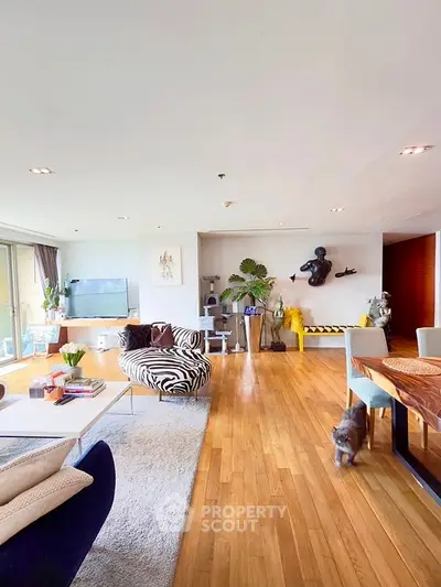 Spacious modern living room with stylish decor and hardwood floors