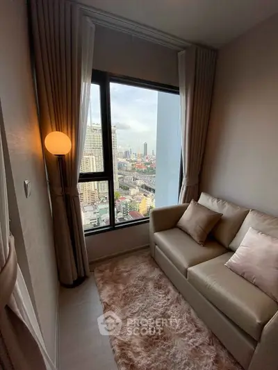 Cozy living room with city view, plush rug, and elegant lighting