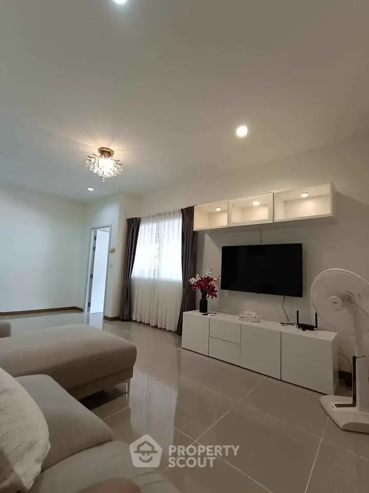 Modern living room with sleek furniture and elegant lighting