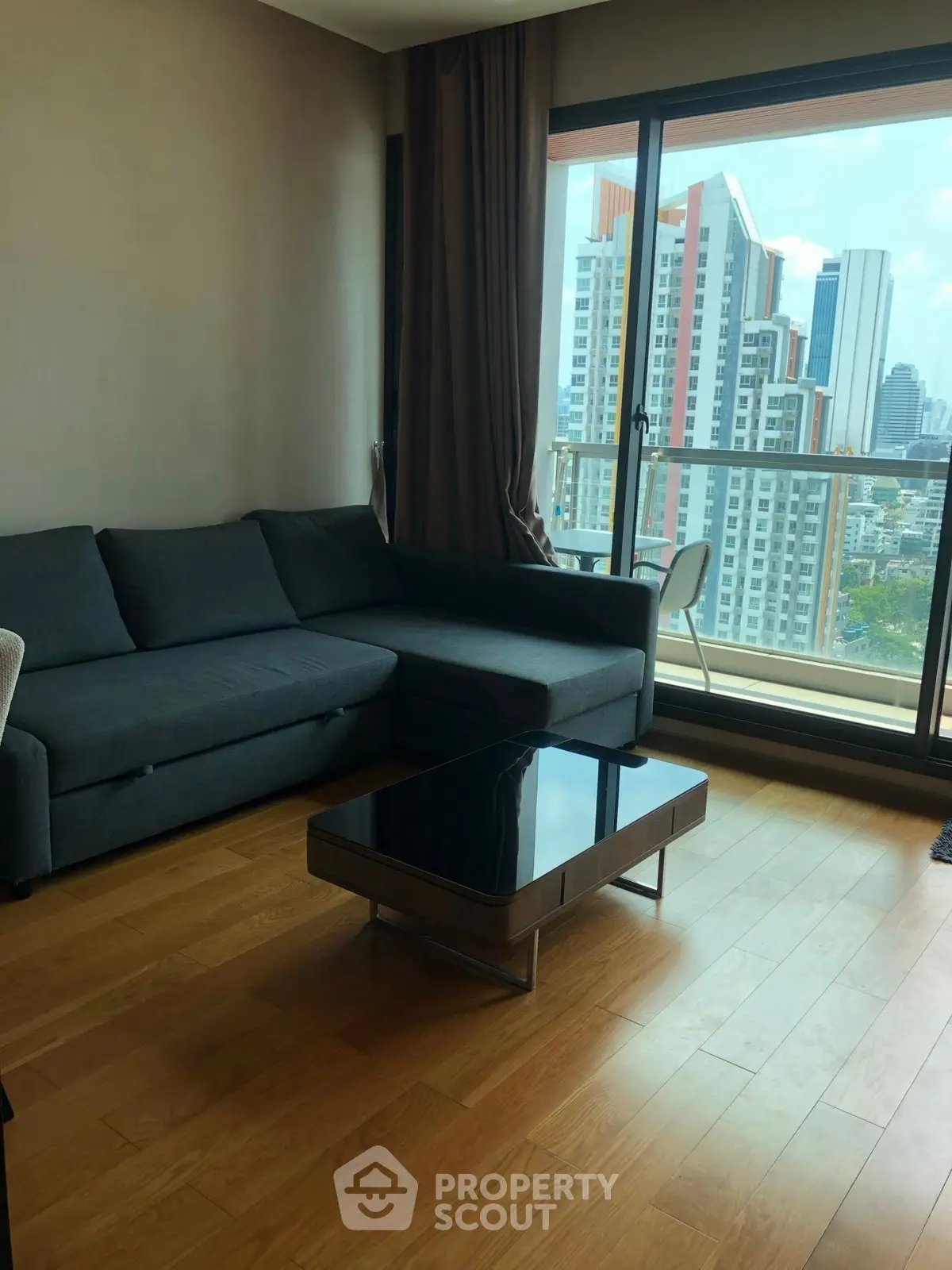 Modern living room with city view and sleek furniture