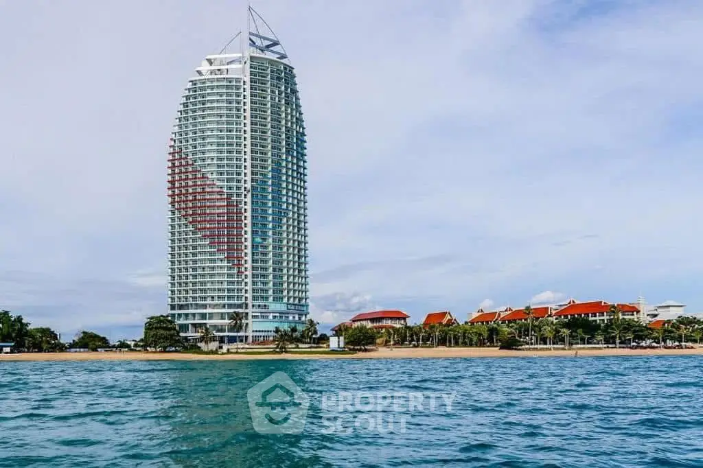 Stunning beachfront high-rise with modern architecture and panoramic ocean views.