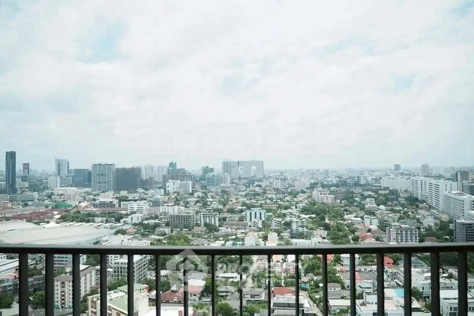 Stunning cityscape view from high-rise balcony, perfect for urban living.