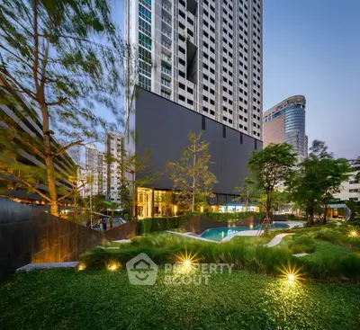 Luxurious high-rise building with lush garden and pool in urban setting, perfect for modern living.