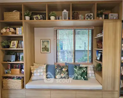 Charming reading nook with built-in shelves and cozy seating, perfect for relaxation and book lovers.