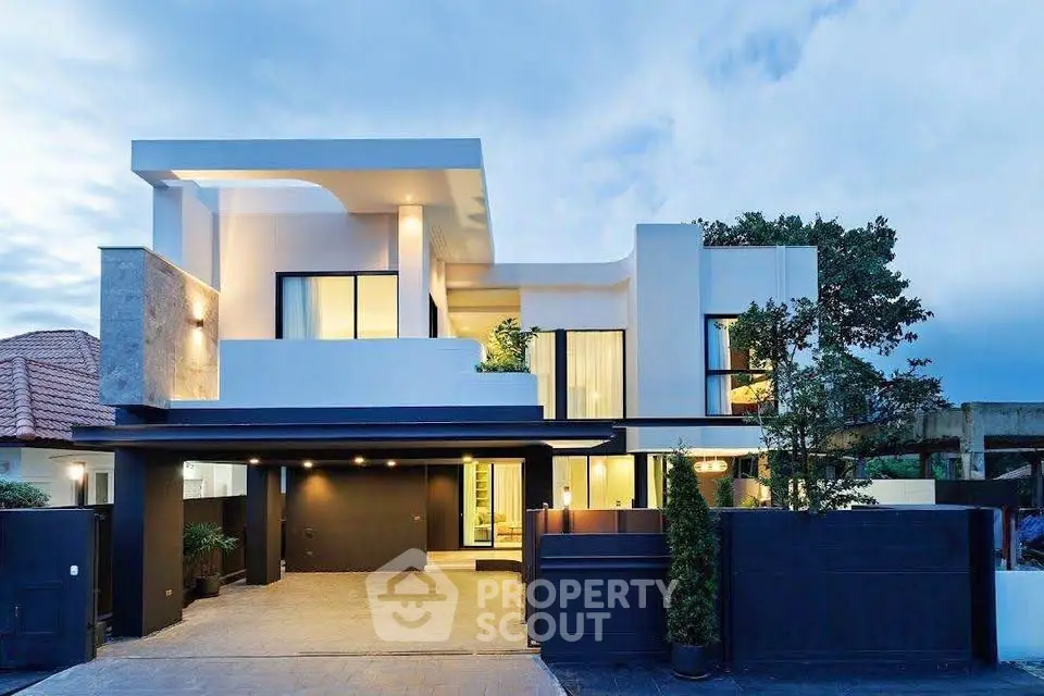 Modern luxury home exterior with sleek design and spacious driveway, perfect for contemporary living.