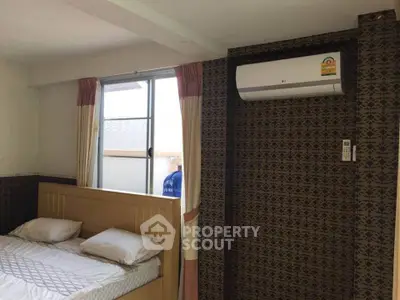 Cozy bedroom with air conditioning and natural light