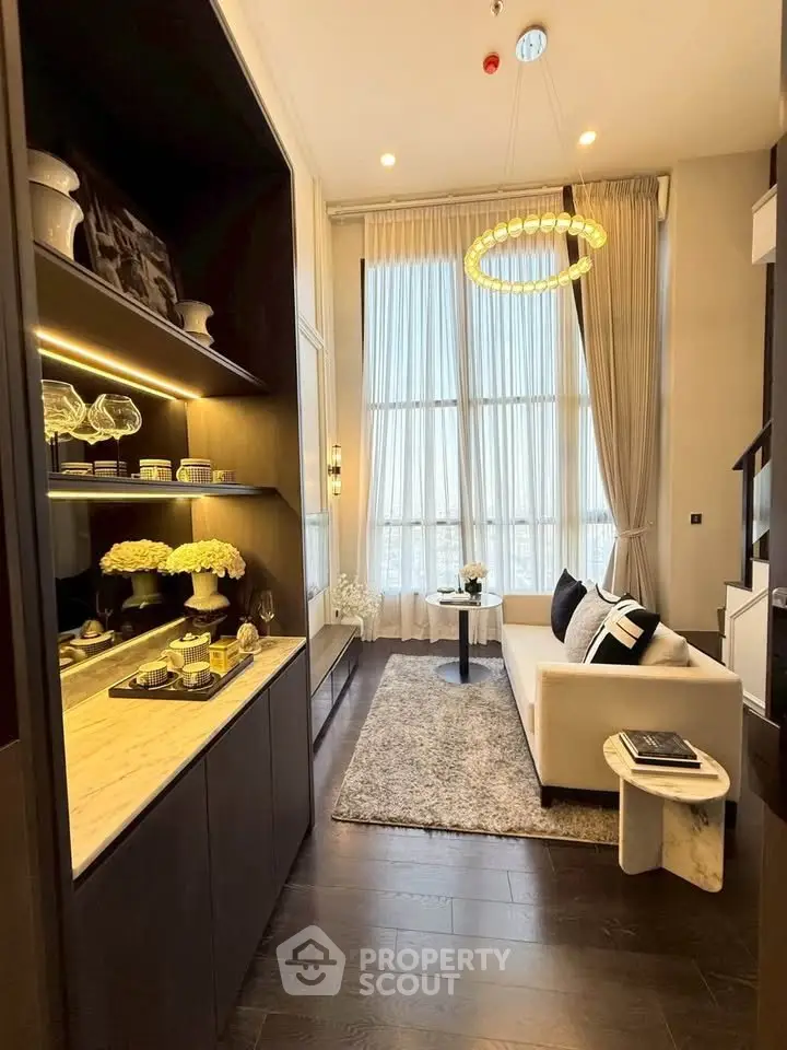 Luxurious modern living room with high ceilings, elegant decor, and large windows for natural light.