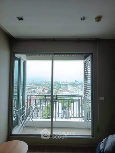 Spacious apartment with stunning city view from large balcony, perfect for urban living.