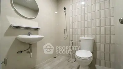 Modern bathroom with sleek fixtures and stylish tile design, perfect for contemporary living.