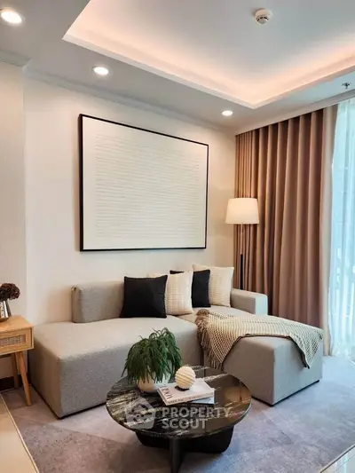 Modern living room with stylish decor, featuring a cozy sectional sofa, elegant coffee table, and ambient lighting.