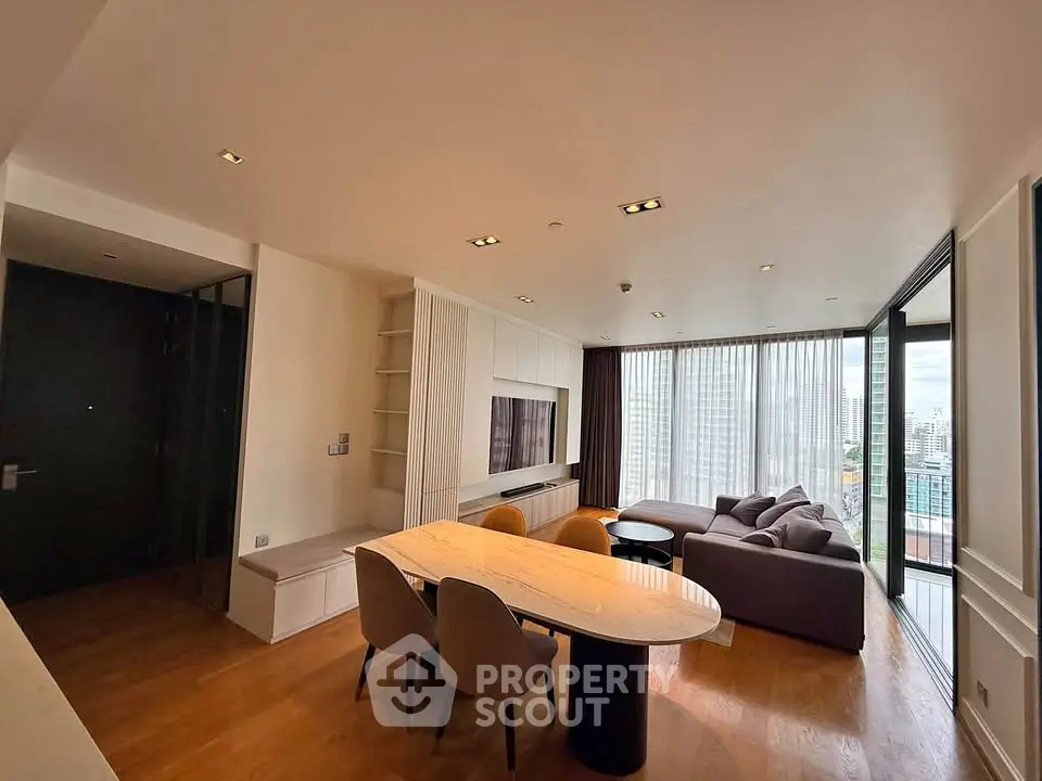 Spacious modern living room with city view and elegant furniture