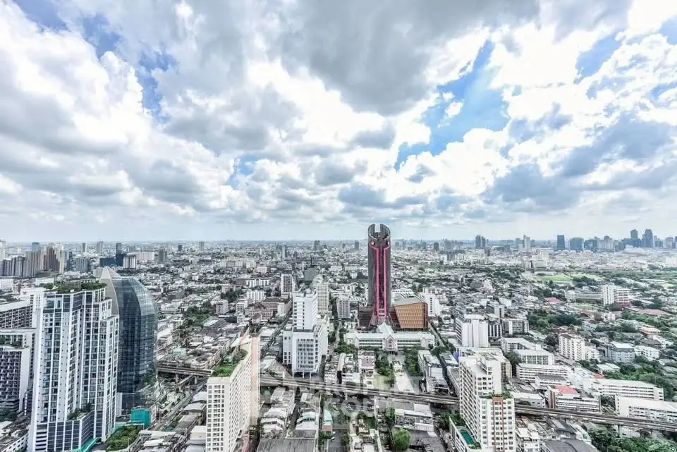 Stunning panoramic cityscape view showcasing urban skyline under a vibrant sky.