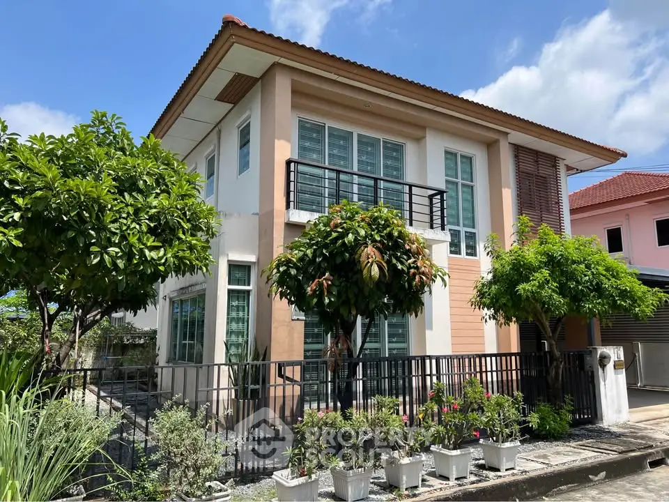 Charming two-story house with lush garden and modern design in a serene neighborhood.
