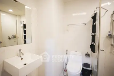 Modern bathroom with sleek white fixtures and minimalist design