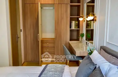 Elegant bedroom with built-in wardrobe and stylish desk, perfect for modern living.