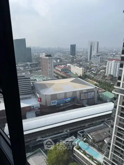 Stunning cityscape view from high-rise building with urban skyline and modern architecture.