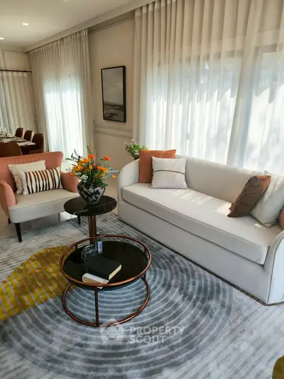 Elegant living room with modern furniture and natural light