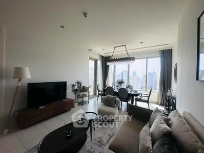 Luxurious living room with stunning city view, modern furniture, and elegant decor in high-rise apartment.