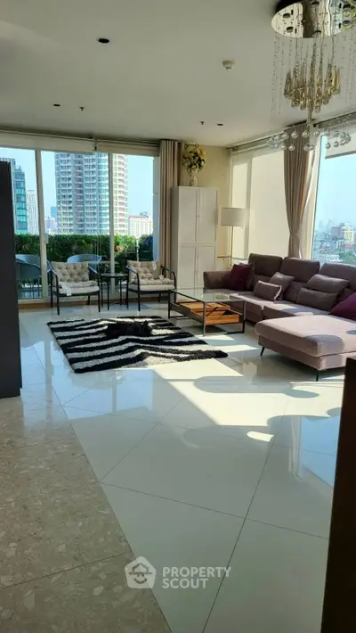 Luxurious living room with modern decor and stunning city view, featuring elegant furniture and ample natural light.