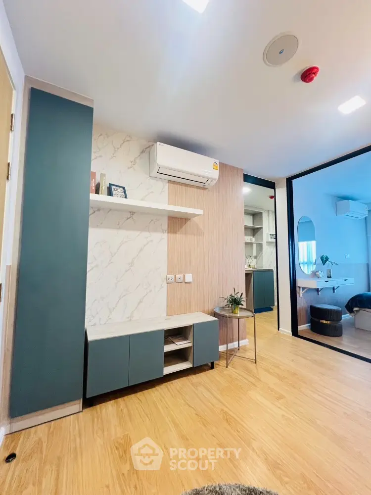 Modern living room with stylish decor and wooden flooring
