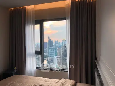 Luxurious bedroom with stunning city skyline view through large window, perfect for urban living.