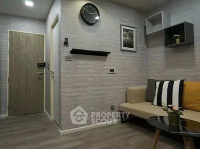 Modern living room with stylish decor and cozy seating area, perfect for relaxation.