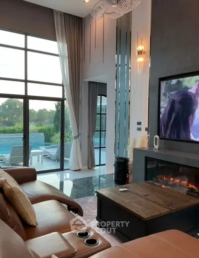 Luxurious living room with pool view, leather sofa, and modern fireplace in a contemporary home.