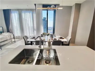 Luxurious open-plan kitchen and dining area with stunning city view