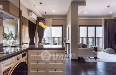 Modern open-plan living room with kitchen and balcony view in luxury apartment