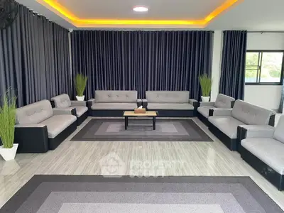 Spacious modern living room with stylish gray sofas and elegant decor