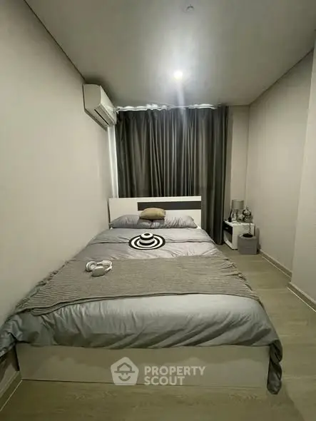 Cozy modern bedroom with stylish decor and natural lighting