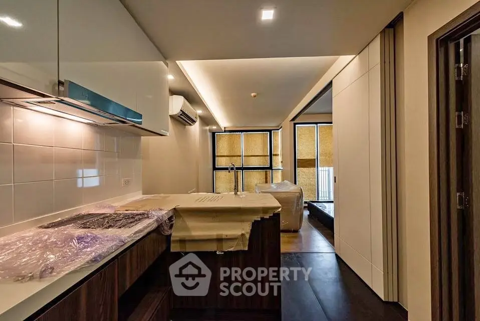 Modern kitchen with sleek design and open layout in a contemporary apartment.