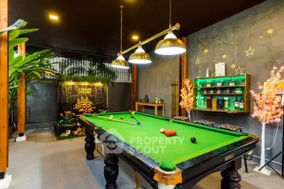 Luxurious home billiard room with stylish decor and ambient lighting