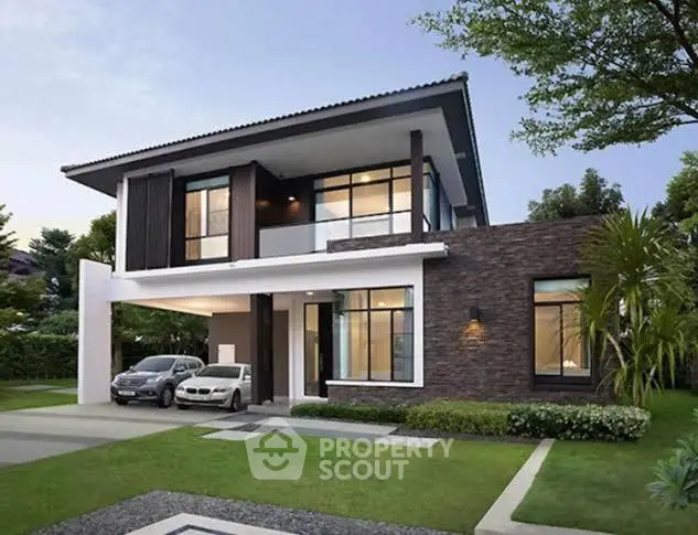 Modern two-story home with elegant design, featuring a mix of brick and wood finishes, large windows, and a lush green lawn.