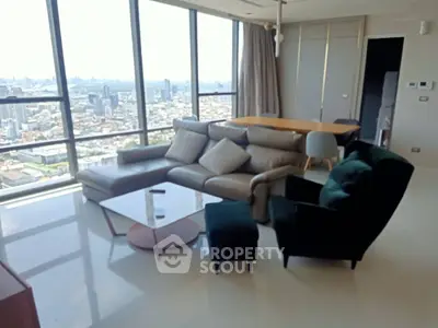 Luxurious high-rise living room with stunning city view and modern furniture.