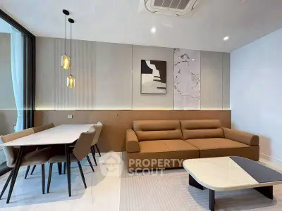 Modern living room with stylish furniture and elegant dining area