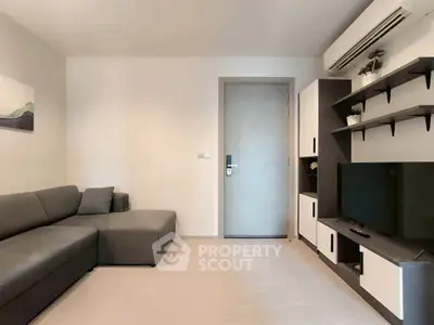 Modern living room with sleek furniture and wall-mounted TV, perfect for cozy relaxation.