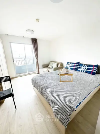 Bright and airy bedroom with balcony access and modern decor