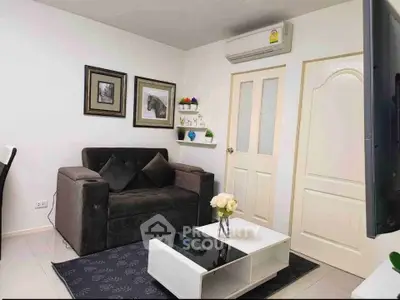 Chic living room with modern decor, cozy sofa, and elegant coffee table in a stylish apartment.