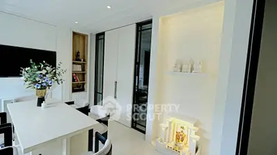 Elegant dining area with modern decor and built-in shelving, perfect for stylish entertaining.